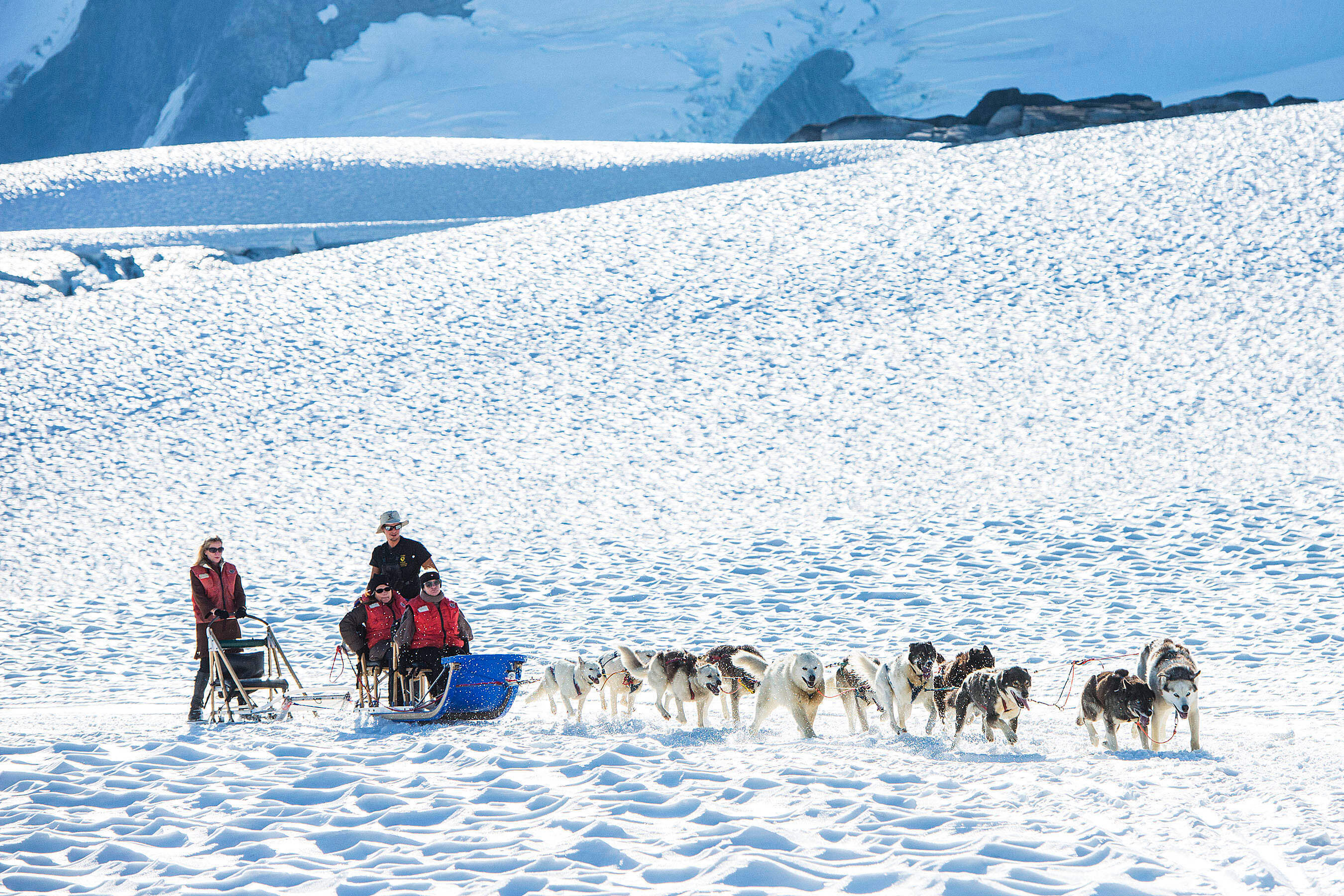As part of the Alaska itinerary, Disney Cruise Line guests explore Musher’s Camp at the Klondike Gold Rush National Historical Park in Skagway. Guests meet the mushers and sled dogs and are whisked on a thrilling ride through Alaska’s temperate rainforest by the husky team. (Matt Stroshane, photographer)